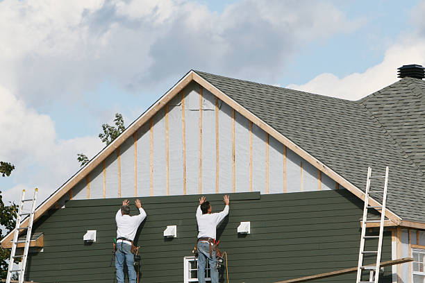 Professional Siding technician working in South Mills, NC
